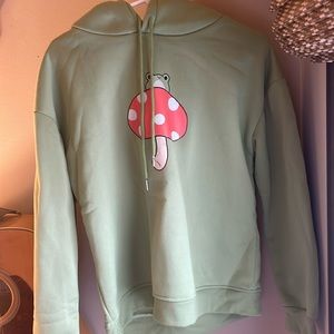 Women’s green frog sweatshirt in size small